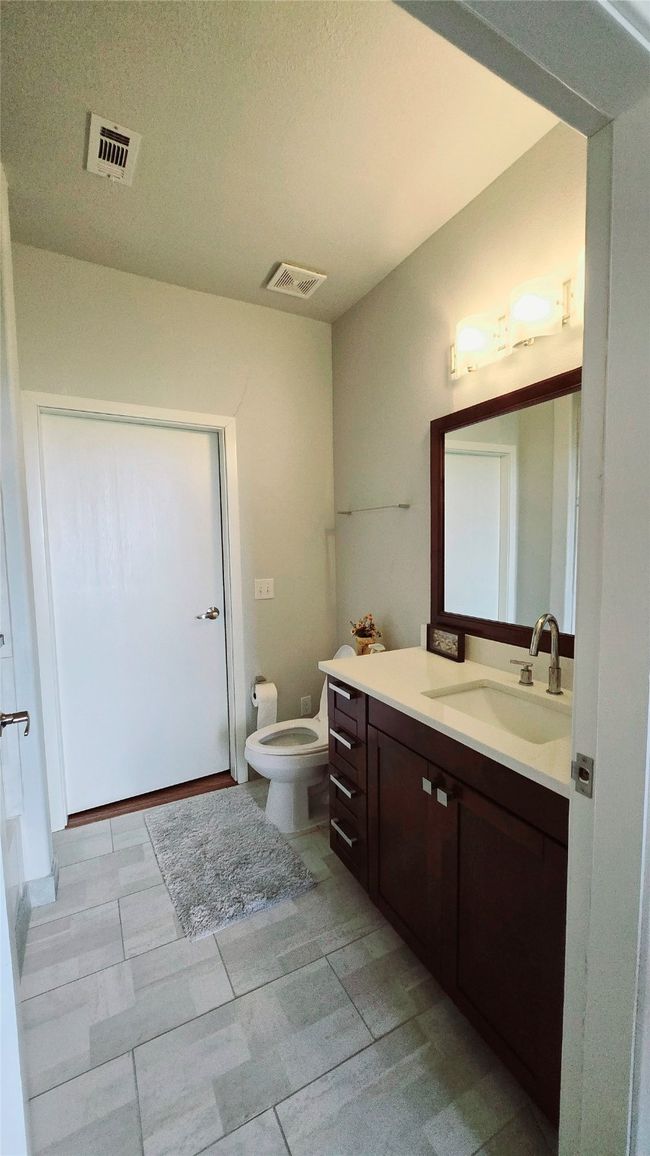 Bathroom featuring vanity and a textured ceiling | Image 8