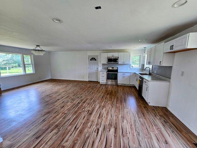 View of kitchen and dining area | Image 7