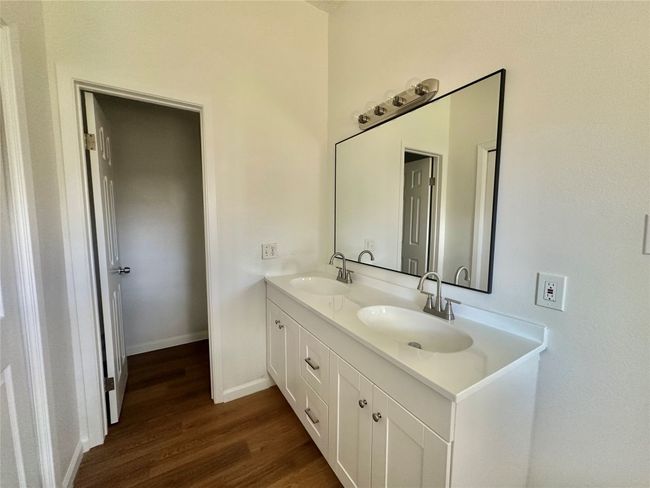 Bathroom featuring wood finished floors and double vanity | Image 16