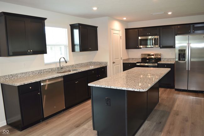 upgraded cabinets ~ island breakfast bar | Image 17