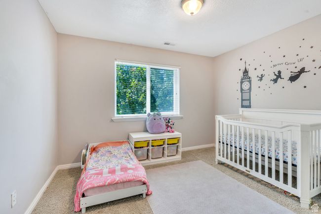 Bedroom with carpet and baseboards | Image 11