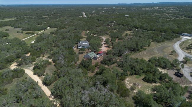 View of property location featuring a heavily wooded area | Image 38