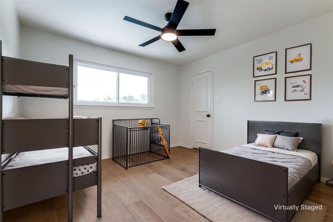 Bedroom featuring wood finished floors and a ceiling fan | Image 18