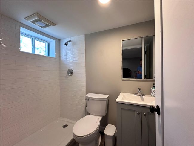 Bathroom featuring a tile shower and vanity | Image 12