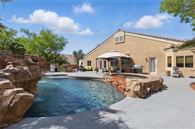Outdoor pool with a gazebo, a patio area, area for grilling, and an in ground hot tub | Image 41