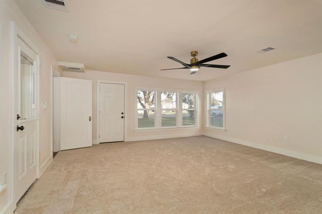 Additionally, two private entrances from outside offer convenient access! One entrance leads directly to a covered outdoor patio, perfect for a quiet morning coffee or evening unwinding. | Image 20