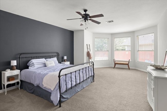 So many possibilities for this room - if you need workout space, a sitting area or a work desk by the bay window. So many possibilities! | Image 13