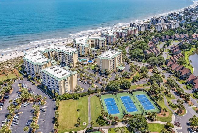 Drone / aerial view of extended coastline and apartment complex | Image 34