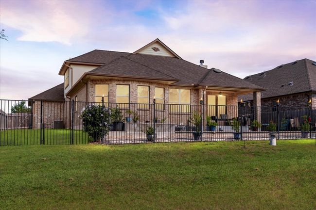 Rear view of house with roof with shingles | Image 32