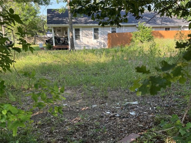 View of yard with fence and a deck | Image 15