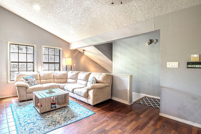 Laminate wood look floor and windows for great natural light | Image 7