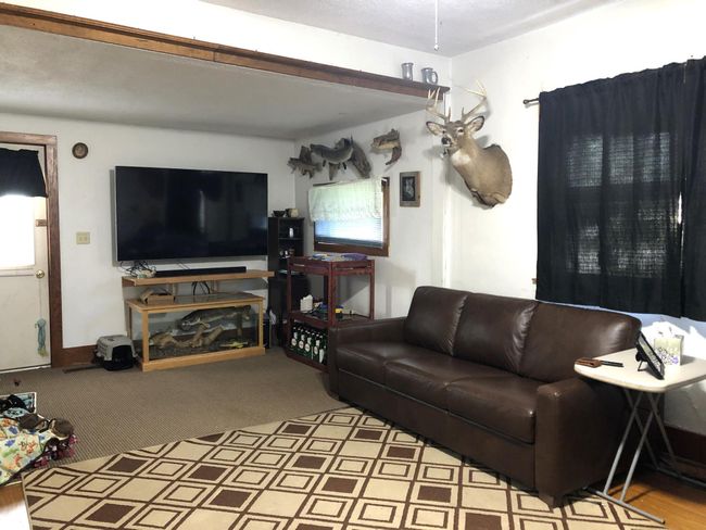 living room to front door | Image 5