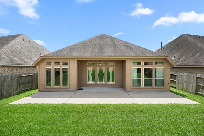 Expanded concrete patio with space for a table, grill, porch swing. | Image 26