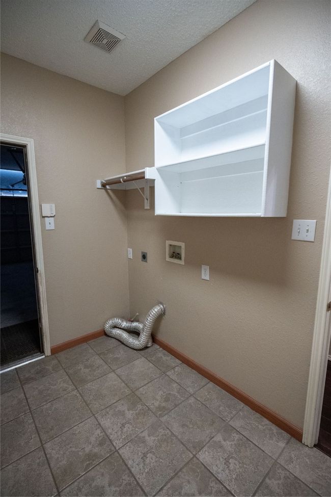 Laundry/mudroom with hookup for washer & electric dryer, additional storage and coat closet | Image 18