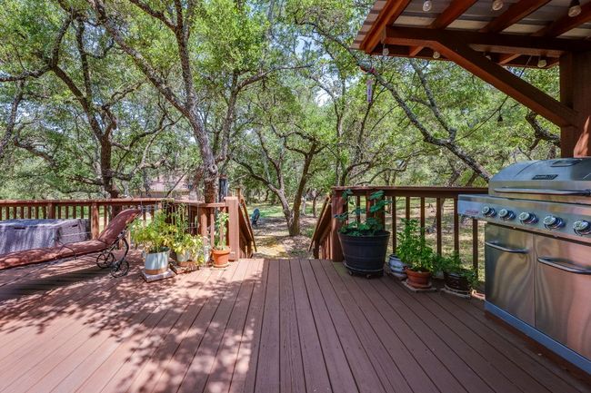 This deck is set among the trees - perfect for bird watching | Image 27