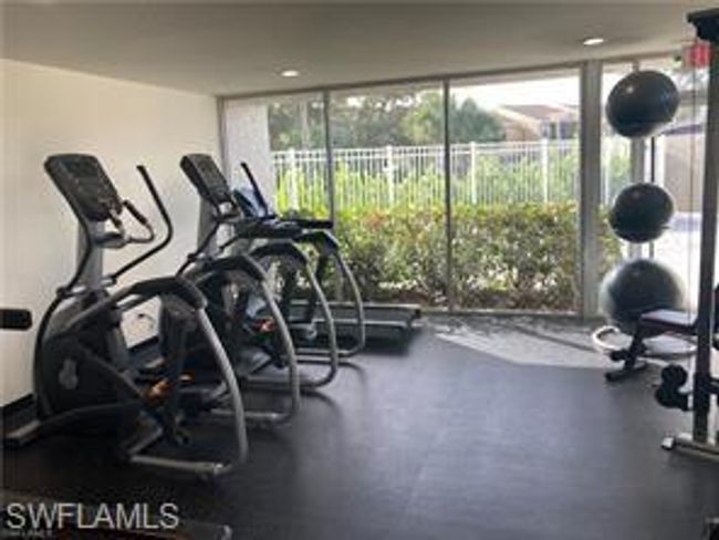 Exercise room featuring expansive windows and plenty of natural light | Image 30