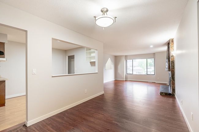 Unfurnished room featuring wood finished floors | Image 7