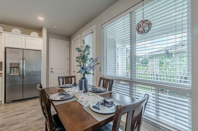 Dining room with light wood-style flooring | Image 15