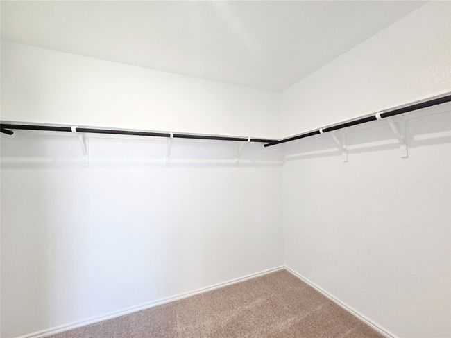 Walk in closet with carpet | Image 13