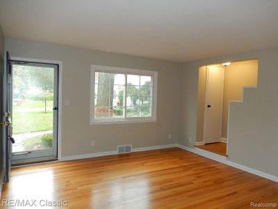 Enter into nice size living room with coat closet | Image 2