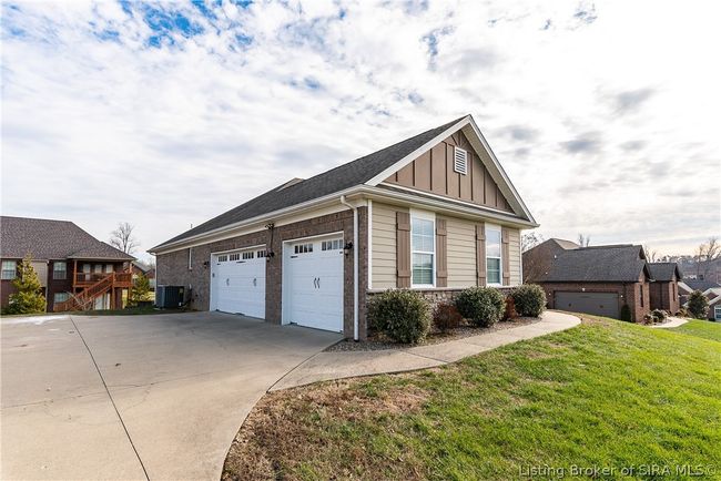 Side entry 3 car garage PLUS a lower level utility garage | Image 4