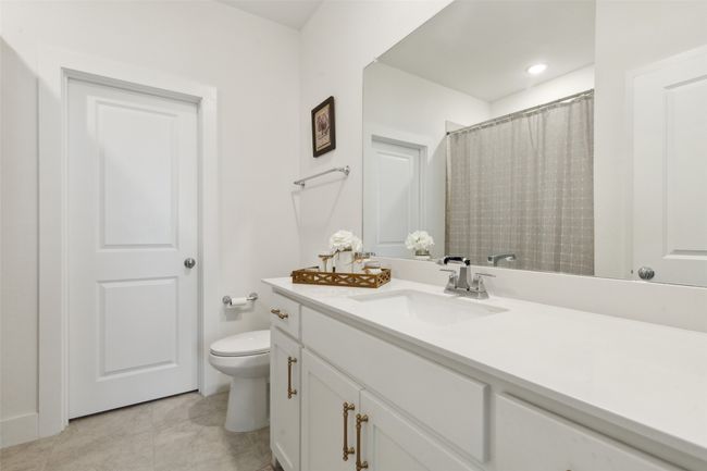 Bathroom featuring toilet, vanity, and tile patterned floors | Image 27