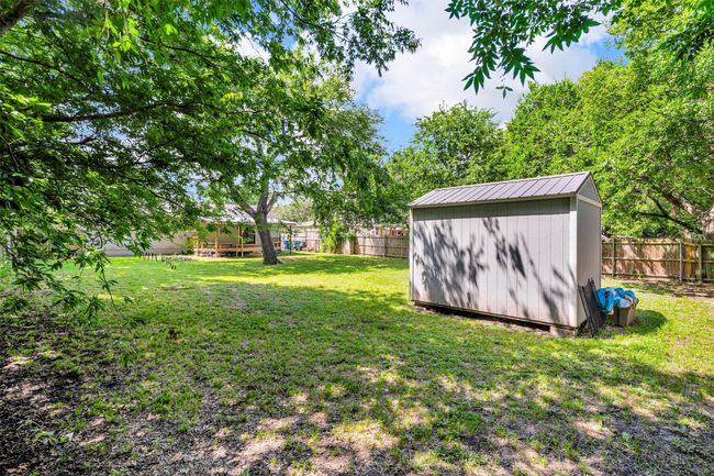 Shed that matches the house stays with the property. | Image 32