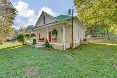 Sit on the front porch and listen to the babbling creek across the road. | Image 3