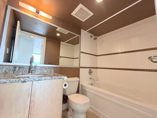Full bathroom featuring washtub / shower combination, vanity, and recessed lighting | Image 21