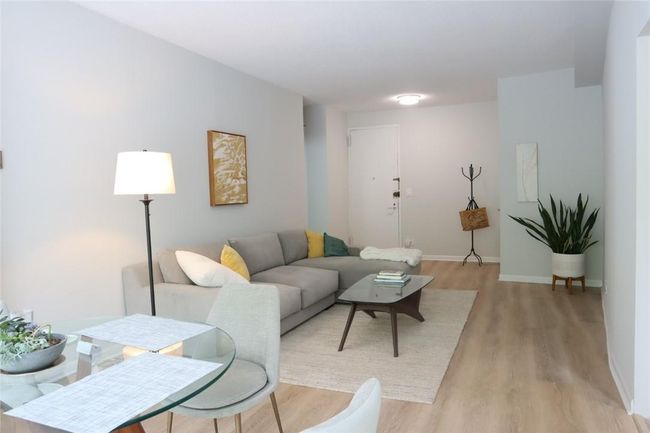 Living room with light hardwood / wood-style flooring | Image 4