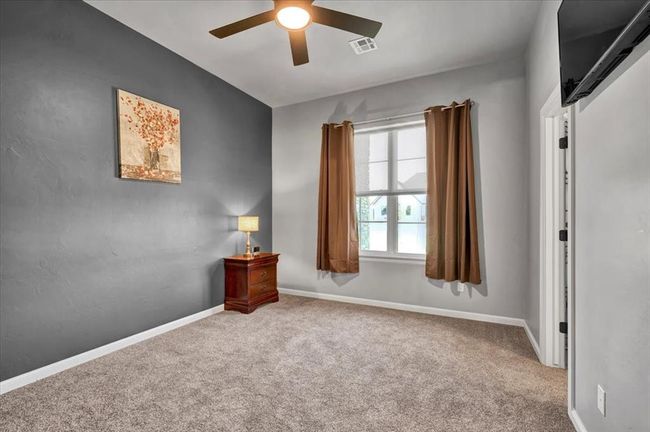 Unfurnished room featuring a ceiling fan, carpet, and baseboards | Image 37
