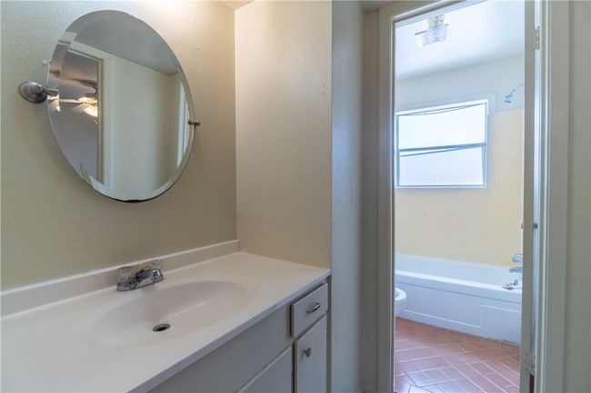Full bathroom featuring vanity, toilet, tile patterned floors, and a ceiling fan | Image 6