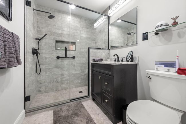Full bathroom featuring vanity and a shower stall | Image 9