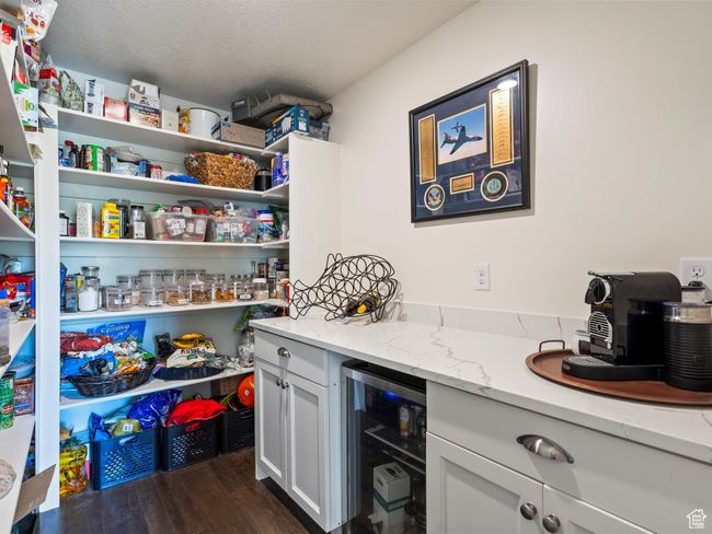 Pantry featuring wine cooler | Image 12