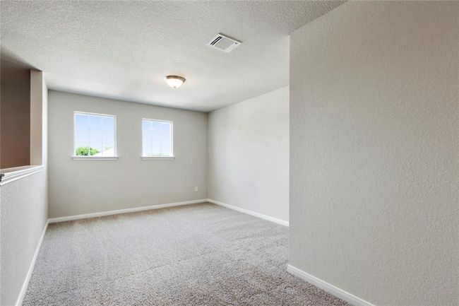 Carpeted spare room with baseboards and a textured ceiling | Image 17