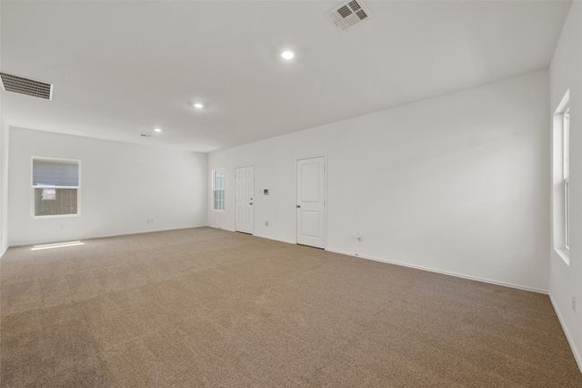 Spare room featuring light carpet and recessed lighting | Image 14