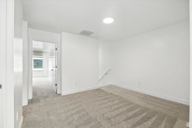 Carpeted spare room with baseboards | Image 9