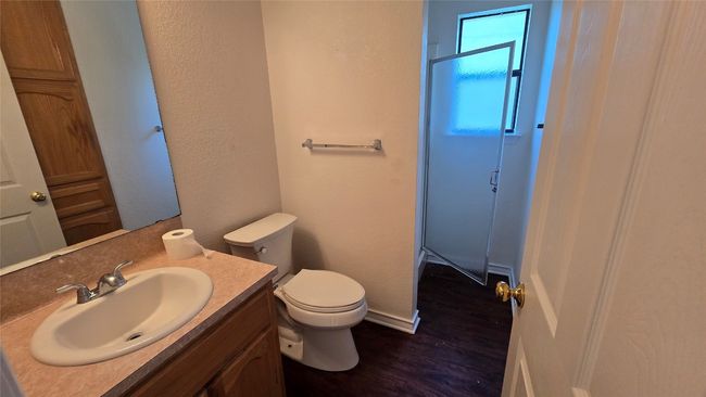Bathroom featuring wood finished floors, a shower stall, and vanity | Image 19