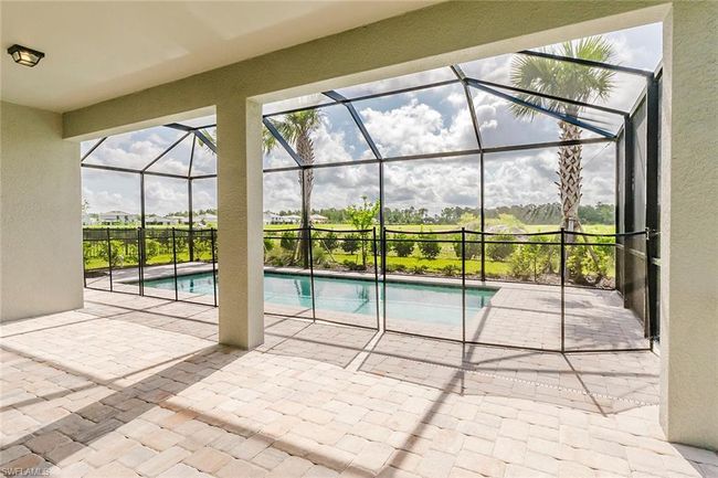 Outdoor pool with a patio and a lanai | Image 31