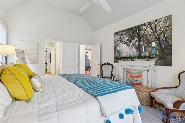 Bedroom with lofted ceiling and a ceiling fan | Image 20