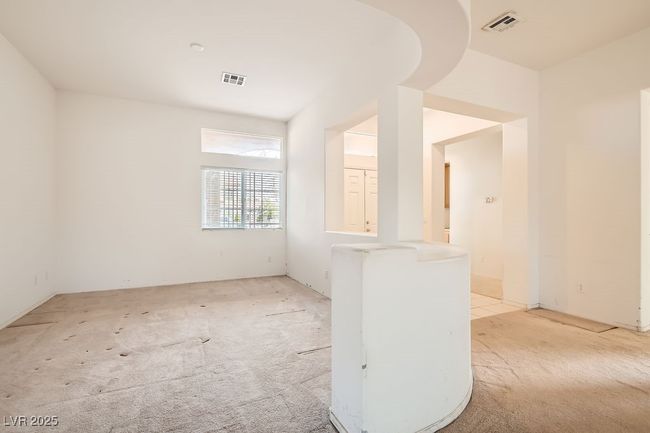 Empty room featuring visible vents and light colored carpet | Image 8
