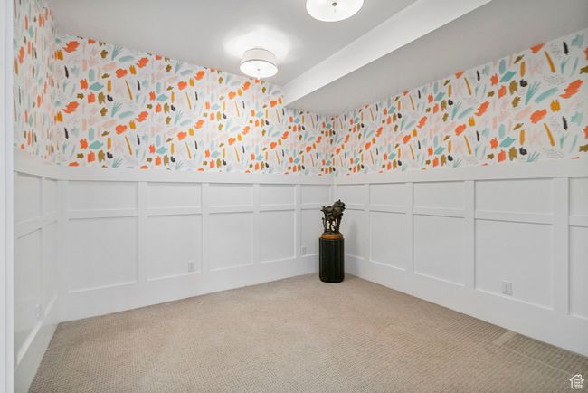 Carpeted spare room with a decorative wall, a wainscoted wall, and wallpapered walls | Image 74