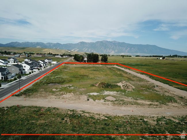 Overview of rural landscape featuring property parcel outlined and mountains | Image 4
