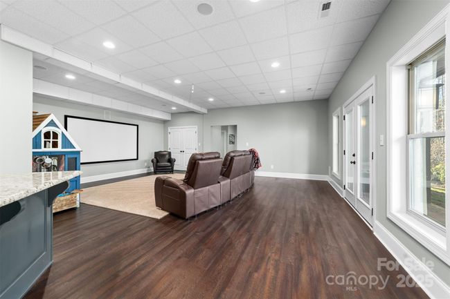 Second Den area with movie screen and plenty of room for larger gatherings. Access to grilling patio. | Image 27