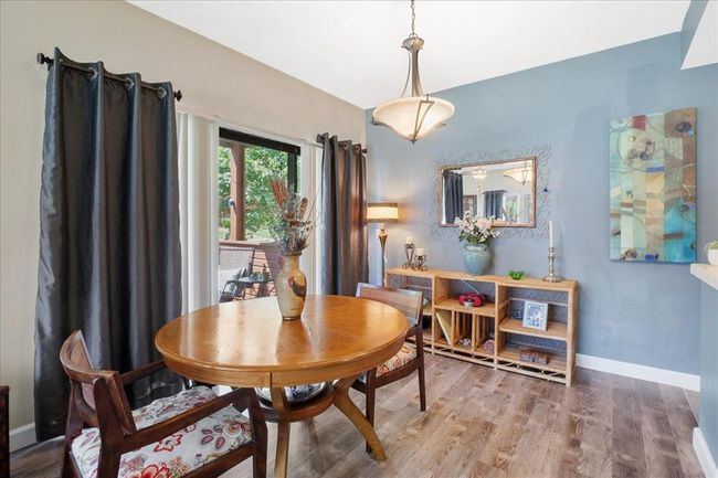 Dining space featuring baseboards and wood finished floors | Image 5