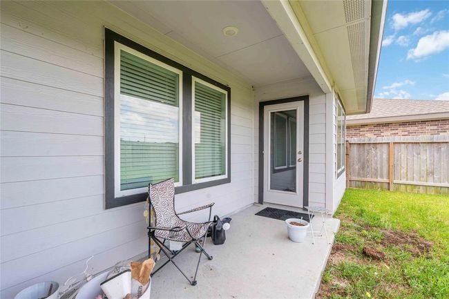 Large covered patio and privacy fencing — ideal for outdoor dining, play, or relaxing evenings. | Image 16