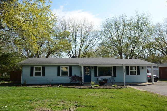 single story home with a front lawn and covered porch | Image 47