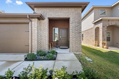 Entrance to property with a garage and a yard | Image 2