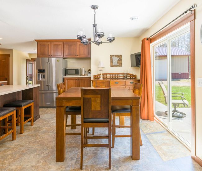 Dining area with sliding door to southwesterly facing patio | Image 11
