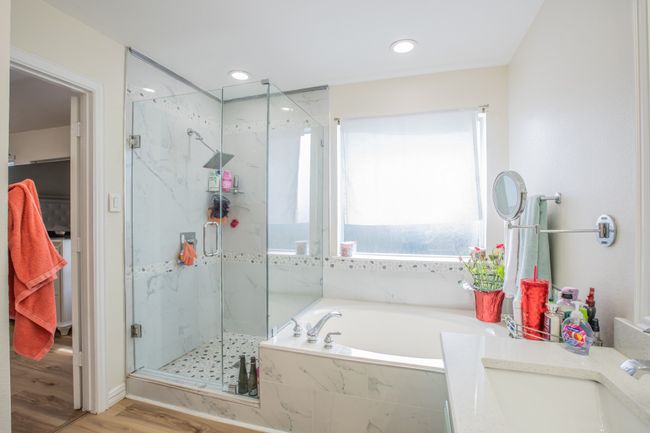 Full bathroom with recessed lighting, wood finished floors, a marble finish shower, a sink, and a garden tub | Image 14